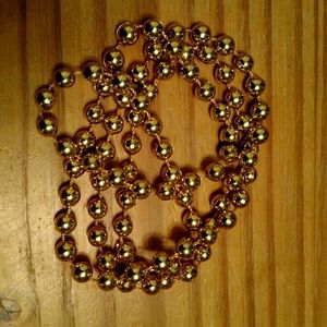 Mardi Gras or New Years Party Beads, gold color